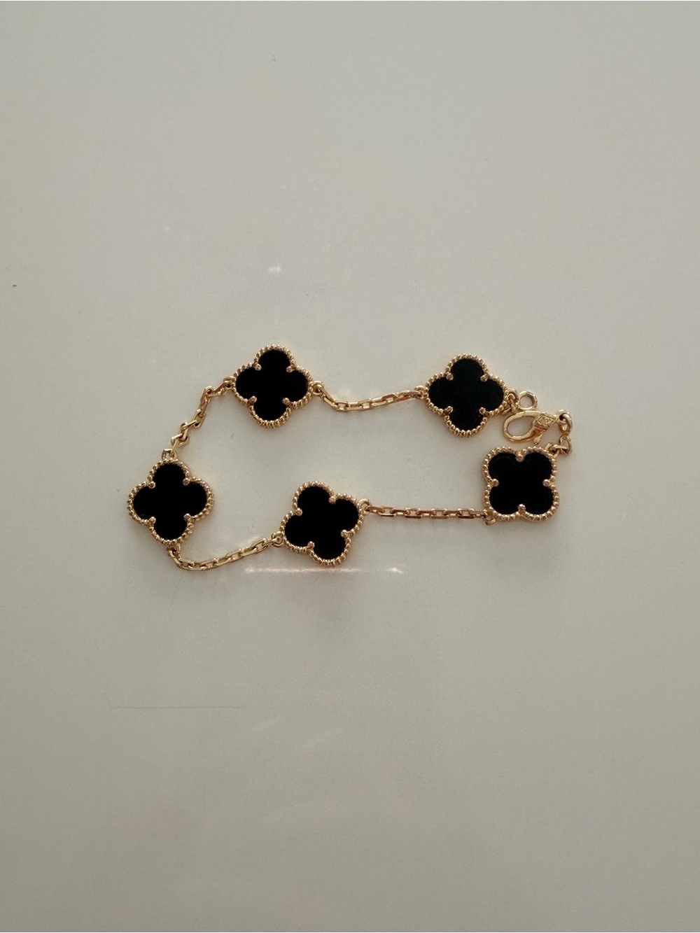 Van Cleef & Arpels Gold Bracelet with Black Alhambra Motifs